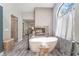 Luxurious soaking tub with a fireplace feature creating a spa-like retreat at 5381 Waving Sage Dr, Las Vegas, NV 89149