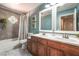 Inviting bathroom showcasing a double vanity, framed mirrors, tub, and tasteful decor, offering a luxurious feel at 5381 Waving Sage Dr, Las Vegas, NV 89149