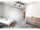Well-lit bedroom boasts a papasan chair and dresser with a large window and closet space at 5381 Waving Sage Dr, Las Vegas, NV 89149
