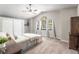 Bedroom with high ceilings, carpet, large windows, closet, and elegant furnishings, creating a peaceful retreat at 5381 Waving Sage Dr, Las Vegas, NV 89149