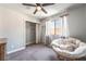 Bright bedroom features a window, closet, and comfy papasan chair for relaxation at 5381 Waving Sage Dr, Las Vegas, NV 89149