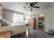 Cozy bedroom featuring a ceiling fan, closet, and neutral color palette at 5381 Waving Sage Dr, Las Vegas, NV 89149