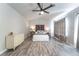 Bright bedroom with a wooden headboard, vaulted ceiling and ample natural light at 5381 Waving Sage Dr, Las Vegas, NV 89149