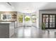 Bright dining area with tile floors, view windows, and access to the kitchen at 5381 Waving Sage Dr, Las Vegas, NV 89149