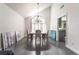 Dining area featuring a modern chandelier, hardwood floors, and view of the kitchen at 5381 Waving Sage Dr, Las Vegas, NV 89149