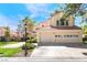 Charming home featuring a tile roof, a three-car garage, and mature landscaping at 5381 Waving Sage Dr, Las Vegas, NV 89149