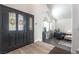 Inviting foyer with a decorative glass front door, vaulted ceiling, and stylish furnishings at 5381 Waving Sage Dr, Las Vegas, NV 89149