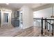 Spacious hallway boasts stylish cabinets and views into an adjacent bath and living areas at 5381 Waving Sage Dr, Las Vegas, NV 89149
