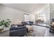 Bright living room featuring vaulted ceilings, modern furnishings, and seamless dining area at 5381 Waving Sage Dr, Las Vegas, NV 89149