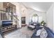 Open-concept living area showcasing high ceilings, dark wood floors, and modern decor at 5381 Waving Sage Dr, Las Vegas, NV 89149
