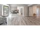 Spacious living room featuring a fireplace and access to the bathroom and backyard at 5381 Waving Sage Dr, Las Vegas, NV 89149