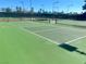 Outdoor pickleball courts feature well-maintained green surfaces, nets, and a covered picnic area for players and guests at 5381 Waving Sage Dr, Las Vegas, NV 89149