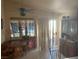Inviting dining area with tiled floors, natural light from a glass door, and adjacent to the kitchen at 5429 Chela Dr, Las Vegas, NV 89120