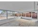 Enclosed patio offers versatile use with concrete flooring and a wooden fenced-in backyard at 5617 Reiter Ave, Las Vegas, NV 89108