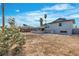 A large backyard with a covered patio, providing a great space for relaxation and outdoor activities at 5617 Reiter Ave, Las Vegas, NV 89108
