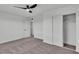Bright bedroom featuring neutral plush carpet, ample closet space, and neutral walls at 5617 Reiter Ave, Las Vegas, NV 89108
