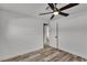 Bedroom featuring wood-look floors, a ceiling fan, and a closet at 5617 Reiter Ave, Las Vegas, NV 89108