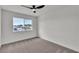 Bedroom with a large window offering a view of the neighborhood outside at 5617 Reiter Ave, Las Vegas, NV 89108