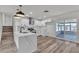 Updated kitchen featuring white cabinets, stainless appliances, and an island with marble countertops at 5617 Reiter Ave, Las Vegas, NV 89108