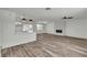 Open-concept living room featuring an electric fireplace, fan and bar seating at 5617 Reiter Ave, Las Vegas, NV 89108
