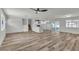 Bright, open-concept living room showcases modern finishes, wood-style floors, and seamless flow into the kitchen at 5617 Reiter Ave, Las Vegas, NV 89108