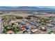 Aerial view featuring residences with green landscaping and solar panels nestled within the neighborhood at 5851 Slate Rock Ct, Las Vegas, NV 89149