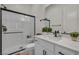 Bathroom featuring modern finishes, white cabinets and shower, and elegant fixtures at 5851 Slate Rock Ct, Las Vegas, NV 89149