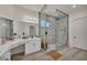 Modern bathroom featuring a glass-enclosed shower, double vanity, and wood-look flooring at 5851 Slate Rock Ct, Las Vegas, NV 89149