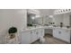 The luxurious bathroom features a spacious vanity, and a large mirror at 5851 Slate Rock Ct, Las Vegas, NV 89149