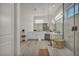 Spacious bathroom showcasing dual vanity, modern shower with a wood bench, and wood flooring at 5851 Slate Rock Ct, Las Vegas, NV 89149