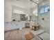 Bright bathroom featuring a dual vanity, wood floors, and a modern glass shower at 5851 Slate Rock Ct, Las Vegas, NV 89149