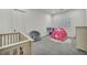 Bright bedroom featuring neutral walls, carpet and a fun tent at 5851 Slate Rock Ct, Las Vegas, NV 89149