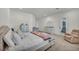 Bright bedroom featuring a king-size bed, a comfortable chair and a large window at 5851 Slate Rock Ct, Las Vegas, NV 89149