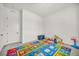 Bright bedroom featuring neutral walls, carpet and an alphabet rug at 5851 Slate Rock Ct, Las Vegas, NV 89149