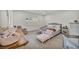 Bright bedroom featuring a king-size bed, large window, and neutral carpet at 5851 Slate Rock Ct, Las Vegas, NV 89149