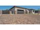 Wide, multi-toned brick driveway leads to a three-car garage, enhancing the home's curb appeal at 5851 Slate Rock Ct, Las Vegas, NV 89149