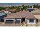 Charming single-story home featuring a beautiful roof, three-car garage, and mountain views in the background at 5851 Slate Rock Ct, Las Vegas, NV 89149