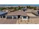 Beautiful exterior featuring a two-car garage and professionally landscaped front yard at 5851 Slate Rock Ct, Las Vegas, NV 89149