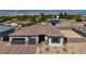 Charming single-story home with a paver driveway, two-car garage, and desert landscaping at 5851 Slate Rock Ct, Las Vegas, NV 89149