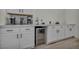 Kitchen area with built-in wine cooler, plenty of storage, and modern design at 5851 Slate Rock Ct, Las Vegas, NV 89149