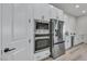 Modern kitchen with white cabinets, stainless steel appliances, and sleek design at 5851 Slate Rock Ct, Las Vegas, NV 89149
