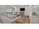 Relaxing living room with a large sectional sofa, modern TV, and cozy decor elements at 5851 Slate Rock Ct, Las Vegas, NV 89149