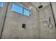 Sleek glass shower featuring a large window, gray tile, and black fixtures at 5851 Slate Rock Ct, Las Vegas, NV 89149