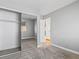 Bedroom featuring mirrored closet doors and neutral carpet at 5861 Medallion Dr # 202, Las Vegas, NV 89122
