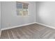Cozy bedroom featuring neutral carpet, a window with blinds, and a closet at 5861 Medallion Dr # 202, Las Vegas, NV 89122