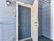 A view of the property's front door, with a screen door open at 5861 Medallion Dr # 202, Las Vegas, NV 89122