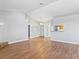 Spacious living room featuring wood-look flooring, a fireplace, and a pass-through to the kitchen at 5861 Medallion Dr # 202, Las Vegas, NV 89122