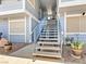 Exterior staircase leading to upper-level units with well-maintained landscaping at 5861 Medallion Dr # 202, Las Vegas, NV 89122
