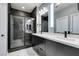 Modern bathroom boasts dual vanities, a glass-enclosed shower, and elegant marble flooring at 649 Tranquil Jade St, Las Vegas, NV 89138