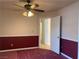 Comfortable bedroom featuring ceiling fan, wainscoting, and an open doorway at 6704 Lost River Ct, Las Vegas, NV 89108